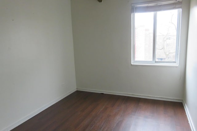 1921 W Hood Ave Unit 3B, Chicago, IL 60660 - unfurnished room with a healthy amount of sunlight, baseboards, and dark wood finished floors