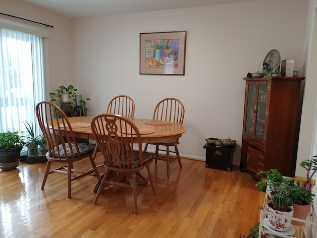 dining room with light wood-style floors