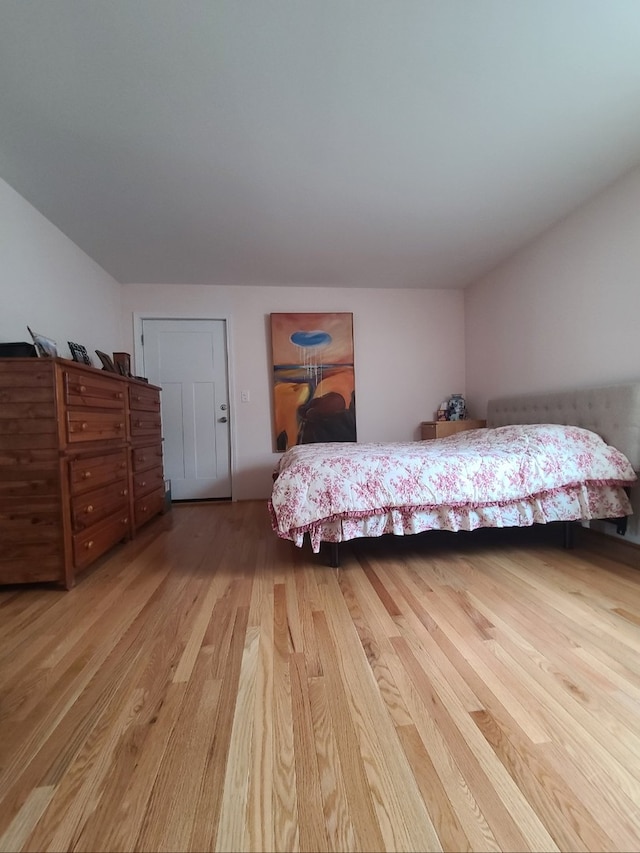 bedroom featuring wood finished floors