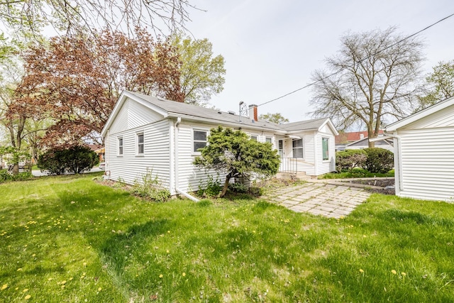 back of property with a yard