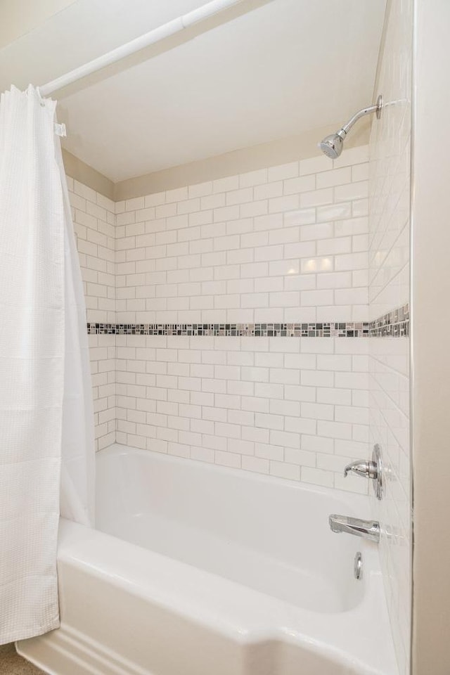 full bath with shower / tub combo with curtain