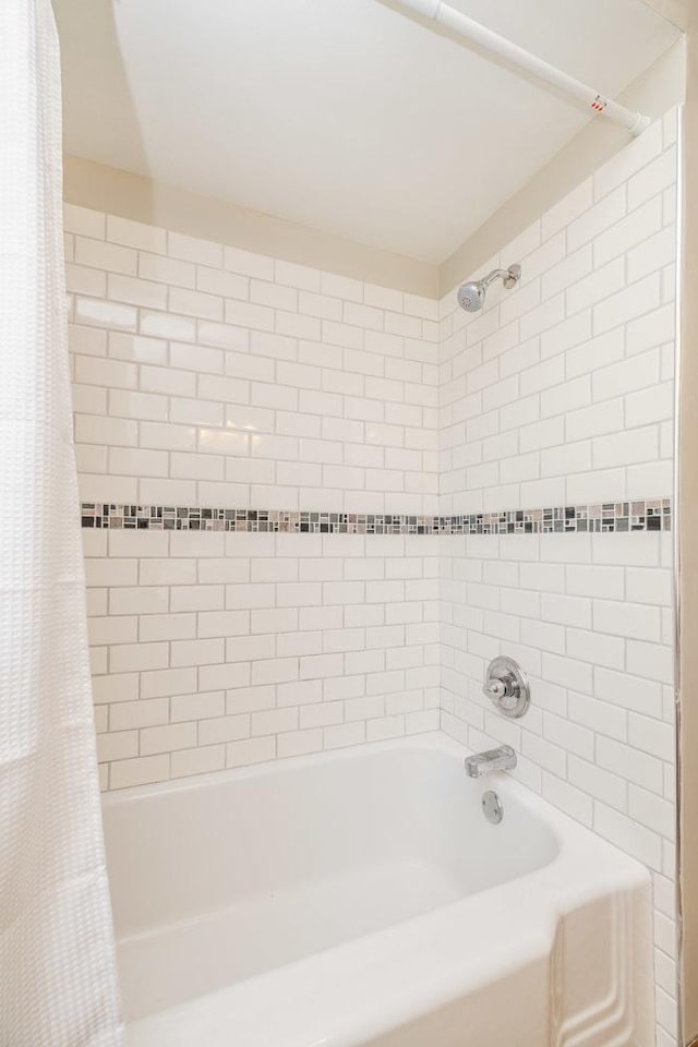 full bathroom with shower / bath combo with shower curtain