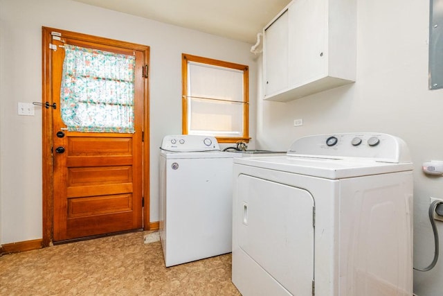 clothes washing area featuring cabinet space, baseboards, washer and clothes dryer, and light floors