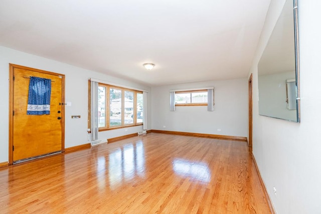 entrance foyer featuring baseboards and light wood-style flooring