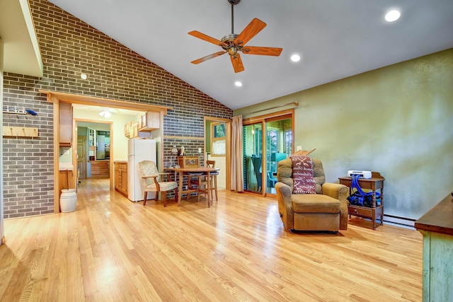 13344 S Stephen Dr, Palos Park, IL 60464 - living area featuring light wood-type flooring, a ceiling fan, brick wall, and high vaulted ceiling