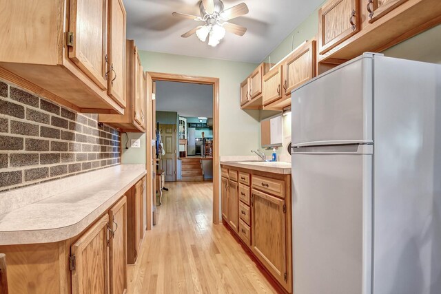 13344 S Stephen Dr, Palos Park, IL 60464 - kitchen featuring freestanding refrigerator, light countertops, tasteful backsplash, light wood-type flooring, and ceiling fan