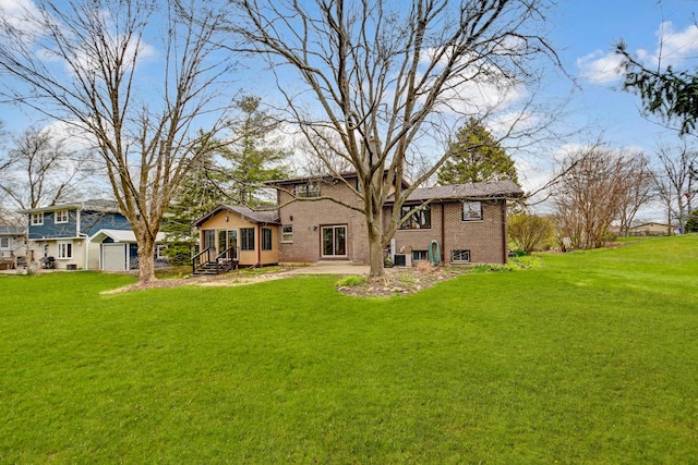 13344 S Stephen Dr, Palos Park, IL 60464 - rear view of house featuring a lawn and brick siding