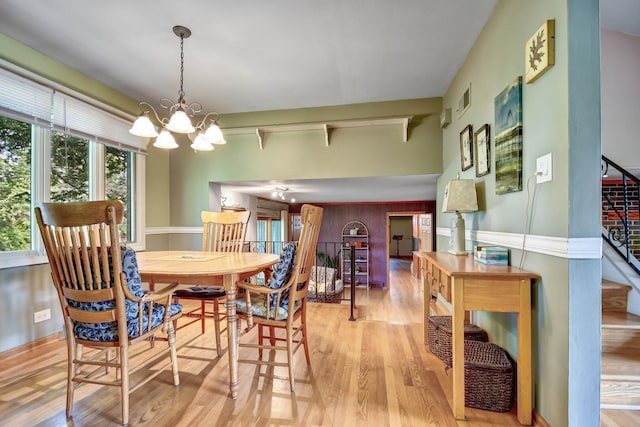 13344 S Stephen Dr, Palos Park, IL 60464 - dining area with a chandelier, wood finished floors, and stairway