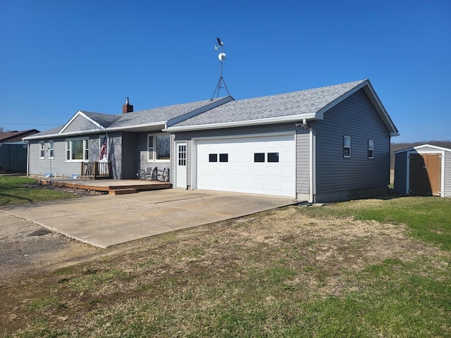 5890 S Il Route 2, Oregon, IL 61061 - view of front of property with an attached garage, a front lawn, a storage shed, an outdoor structure, and driveway