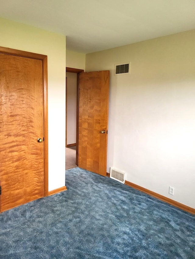 5890 S Il Route 2, Oregon, IL 61061 - unfurnished bedroom featuring visible vents, carpet, and baseboards