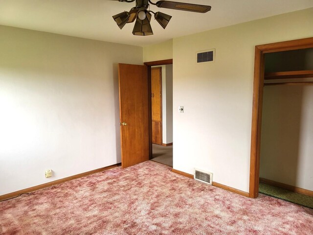 5890 S Il Route 2, Oregon, IL 61061 - unfurnished bedroom with carpet flooring, baseboards, visible vents, and a closet