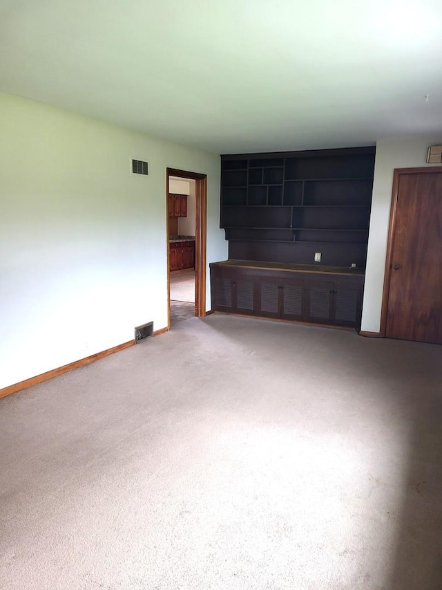 5890 S Il Route 2, Oregon, IL 61061 - unfurnished living room with baseboards, carpet flooring, and visible vents