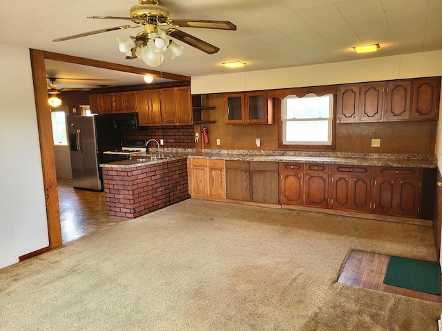 5890 S Il Route 2, Oregon, IL 61061 - kitchen with a ceiling fan, a peninsula, a wealth of natural light, and stainless steel fridge with ice dispenser