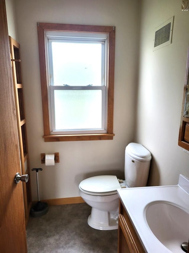 5890 S Il Route 2, Oregon, IL 61061 - bathroom featuring vanity, toilet, and visible vents