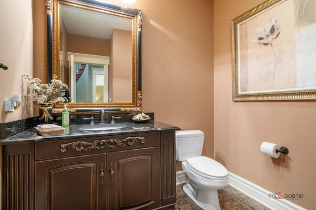 14705 W Mayland Villa Rd, Lincolnshire, IL 60069 - half bath featuring toilet, baseboards, vanity, and tile patterned flooring