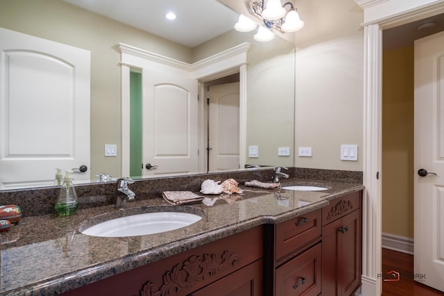 14705 W Mayland Villa Rd, Lincolnshire, IL 60069 - full bathroom with double vanity, recessed lighting, and wood finished floors