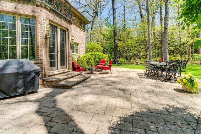 14705 W Mayland Villa Rd, Lincolnshire, IL 60069 - view of patio / terrace featuring french doors, a grill, and outdoor dining space
