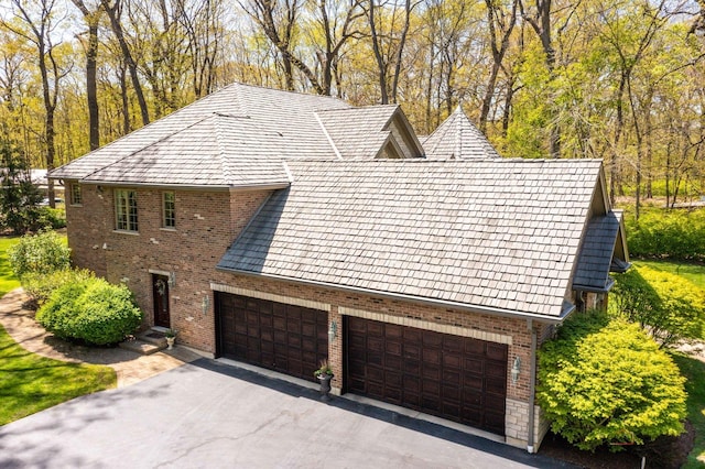 14705 W Mayland Villa Rd, Lincolnshire, IL 60069 - view of property exterior featuring brick siding and asphalt driveway