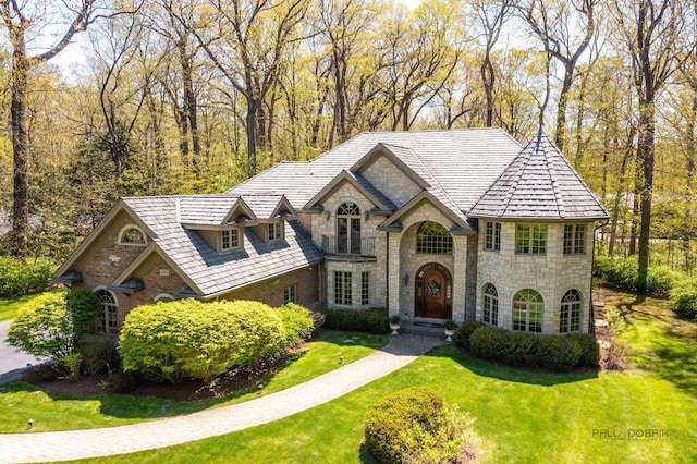 14705 W Mayland Villa Rd, Lincolnshire, IL 60069 - french country inspired facade with stone siding and a front lawn