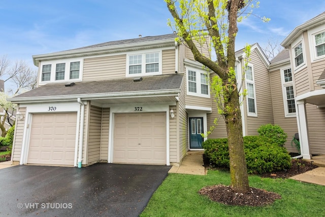 view of front of home with an attached garage and driveway