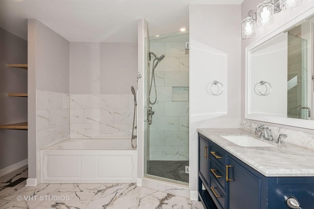 bathroom with a bath, a shower stall, marble finish floor, and vanity