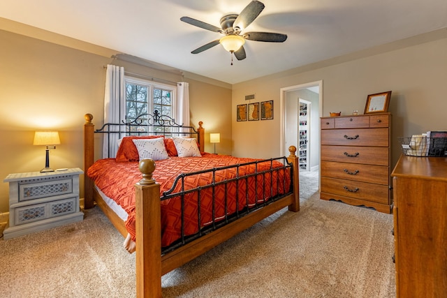 bedroom featuring visible vents, a ceiling fan, and carpet flooring