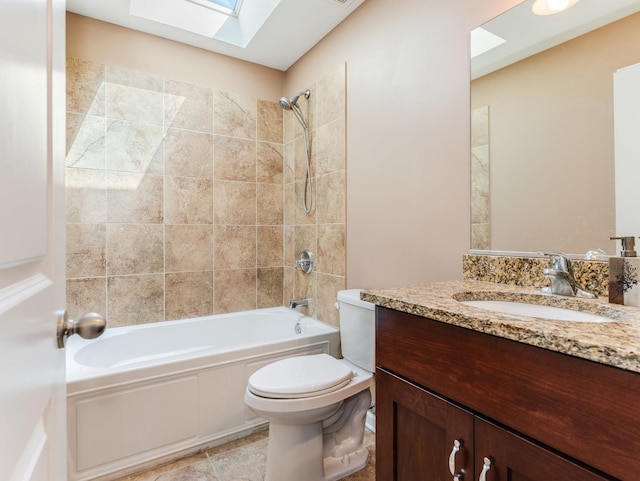 full bathroom with a skylight, toilet, tub / shower combination, and vanity