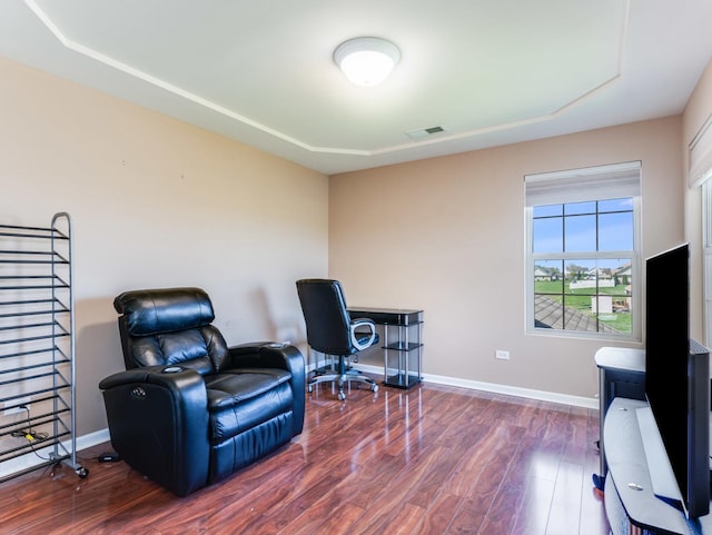 office space with wood finished floors and baseboards