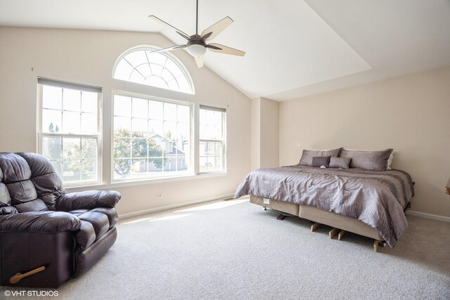 carpeted bedroom with baseboards, high vaulted ceiling, and ceiling fan