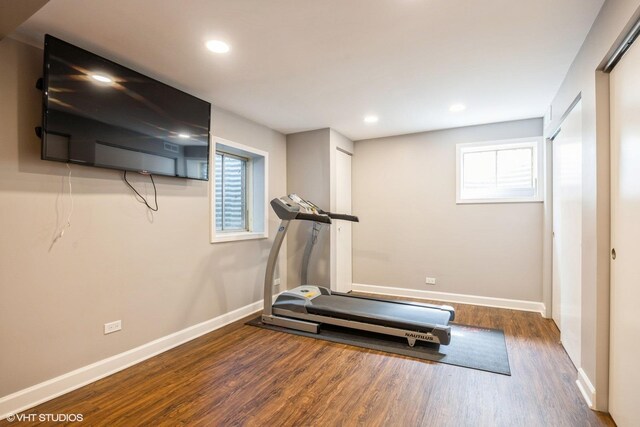 workout room with wood finished floors, recessed lighting, and baseboards