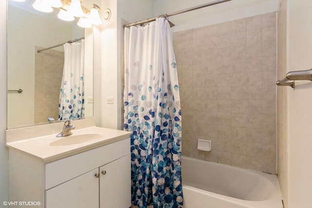 bathroom featuring vanity and shower / bathtub combination with curtain