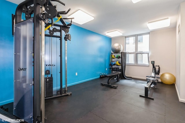 workout area featuring baseboards