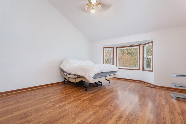 2084 Maplewood Cir, Naperville, IL 60563 - bedroom with light wood-style flooring, baseboards, vaulted ceiling, and visible vents