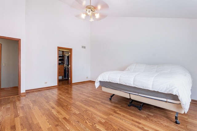 2084 Maplewood Cir, Naperville, IL 60563 - bedroom with baseboards, a spacious closet, a high ceiling, light wood-style floors, and visible vents