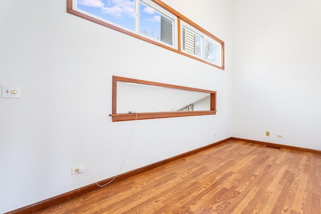 2084 Maplewood Cir, Naperville, IL 60563 - spare room featuring visible vents, baseboards, and wood finished floors