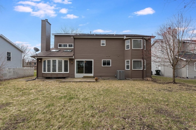 2084 Maplewood Cir, Naperville, IL 60563 - rear view of property with cooling unit, fence, a lawn, and a chimney