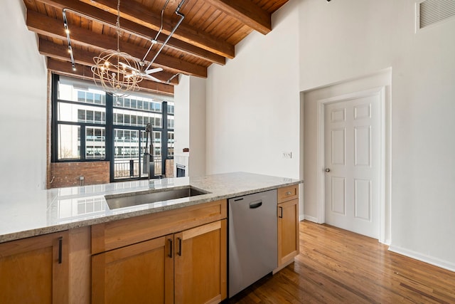 bar with visible vents, a sink, wood ceiling, beamed ceiling, and stainless steel dishwasher