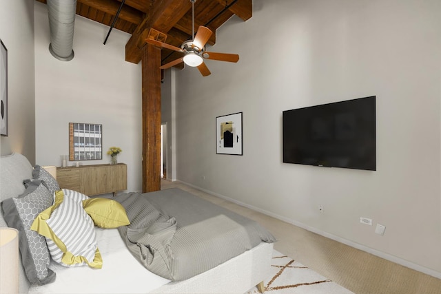 bedroom with high vaulted ceiling, baseboards, beam ceiling, and carpet floors