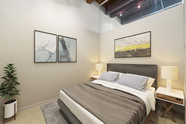 carpeted bedroom featuring wooden ceiling, beamed ceiling, and baseboards