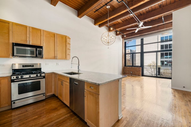 kitchen with a sink, dark wood-style floors, wooden ceiling, and stainless steel appliances