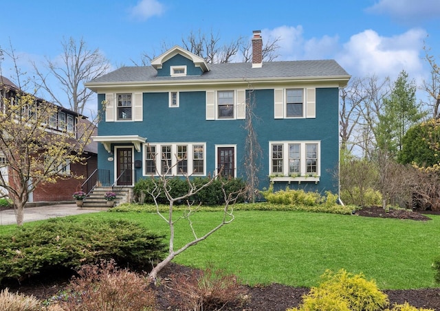 1149 Scott Ave, Winnetka, IL 60093 - view of front facade featuring stucco siding, a chimney, and a front lawn