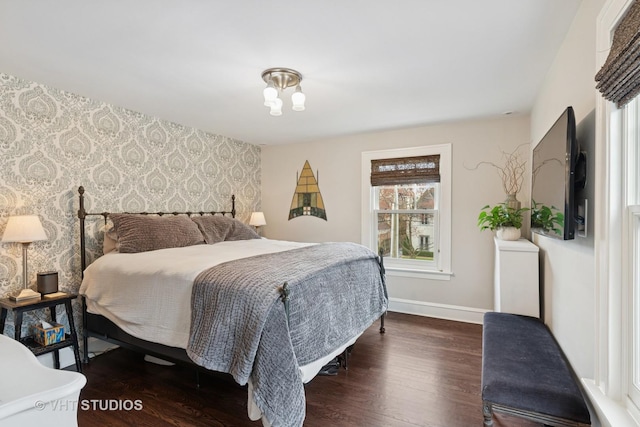 1149 Scott Ave, Winnetka, IL 60093 - bedroom featuring baseboards, wood finished floors, an accent wall, and wallpapered walls