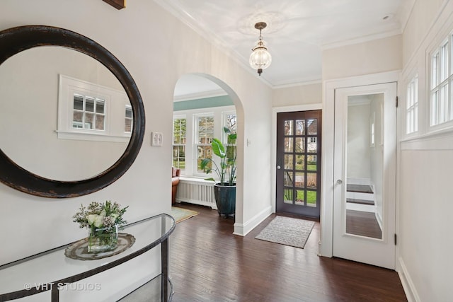 1149 Scott Ave, Winnetka, IL 60093 - foyer entrance with arched walkways, dark wood-style floors, radiator heating unit, and a healthy amount of sunlight