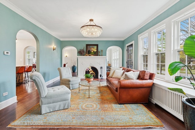 1149 Scott Ave, Winnetka, IL 60093 - living room featuring ornamental molding, arched walkways, and wood finished floors