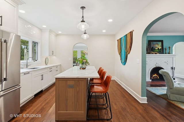1149 Scott Ave, Winnetka, IL 60093 - kitchen with decorative backsplash, high end appliances, wall chimney exhaust hood, a sink, and dark wood finished floors