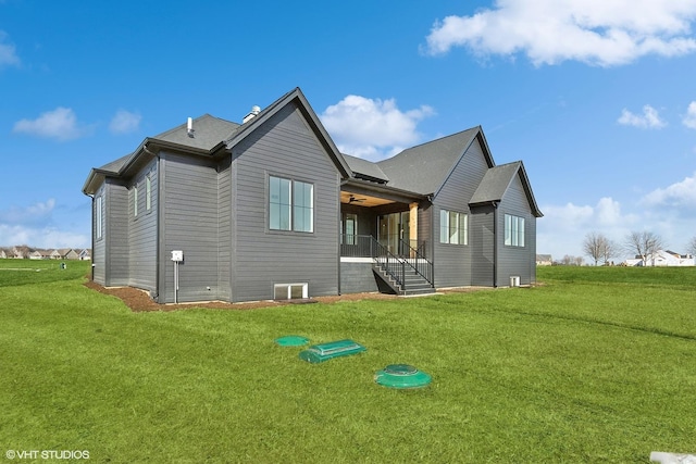 back of property with a yard