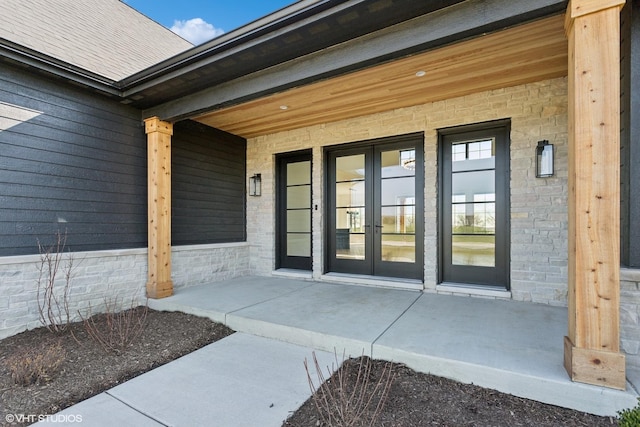 entrance to property featuring a patio area and french doors