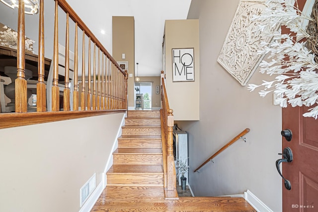 6834 Oak View Ct, Oak Forest, IL 60452 - stairs featuring wood finished floors, baseboards, and a towering ceiling