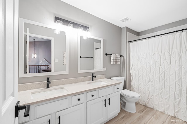6834 Oak View Ct, Oak Forest, IL 60452 - full bathroom with toilet, double vanity, wood finished floors, connected bathroom, and curtained shower