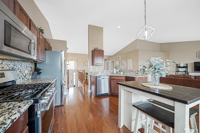 6834 Oak View Ct, Oak Forest, IL 60452 - kitchen with appliances with stainless steel finishes, a chandelier, dark wood-style floors, hanging light fixtures, and lofted ceiling
